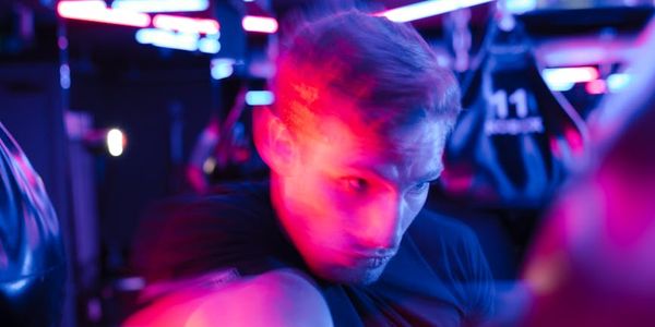 Motion blur of a man performing a dynamic strength exercise